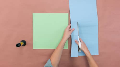 se your ruler to measure ½ inch on the blue construction paper. Cut ½ strips of blue construction paper