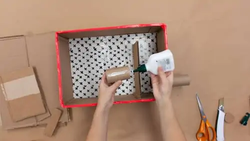 glue craft roll onto cardboard ramp