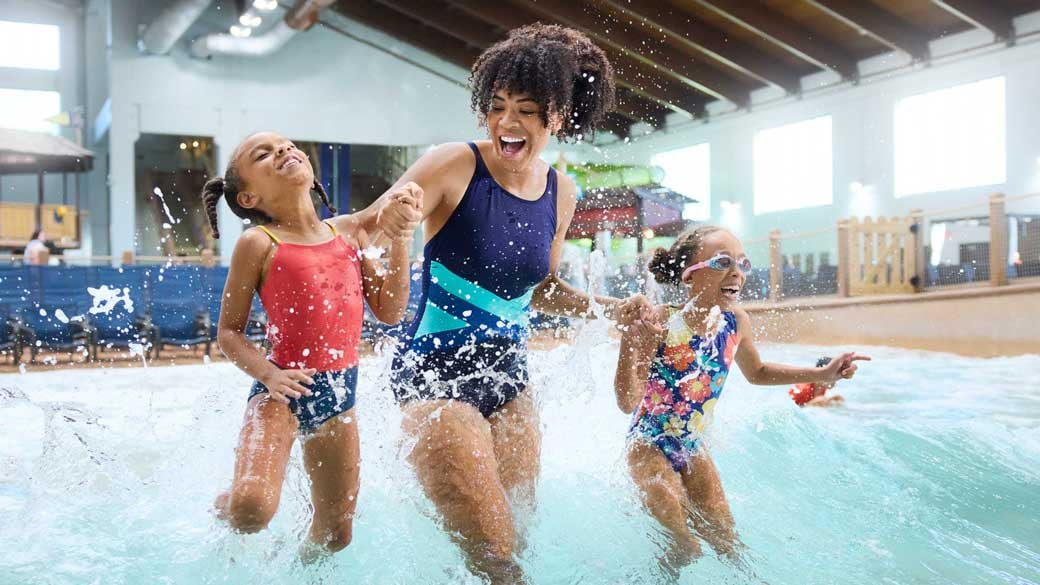 mother and girls enjoying indoor water park