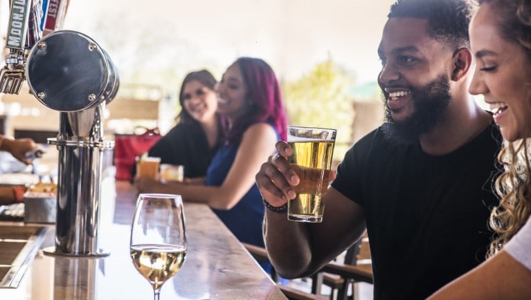 people drinking at the bar