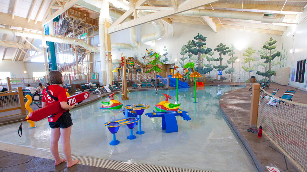 mother and child enjoying in a kidee pool in waterpark