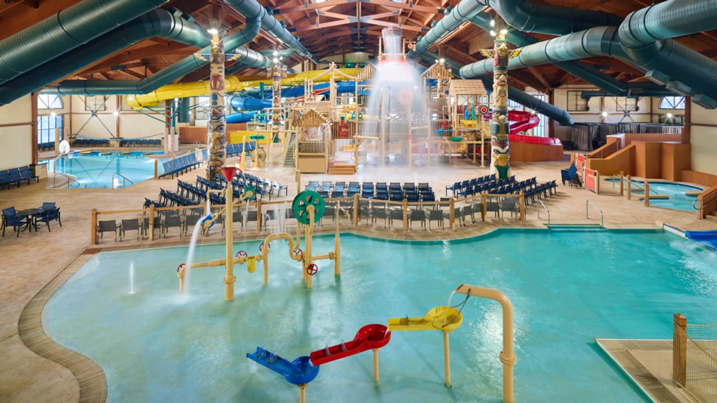 mother and child enjoying in a kidee pool in waterpark