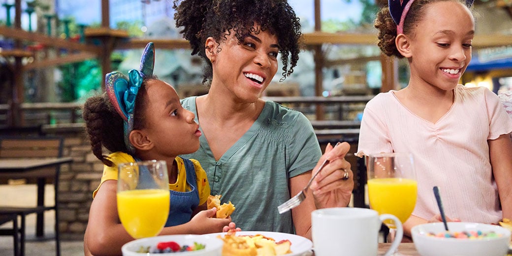 mother and daughters having breakfast