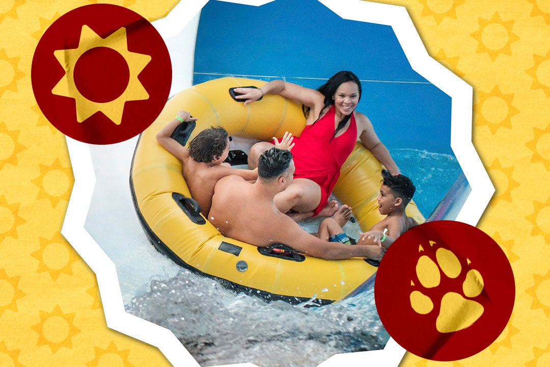 family sliding down a water slider in a yellow floats