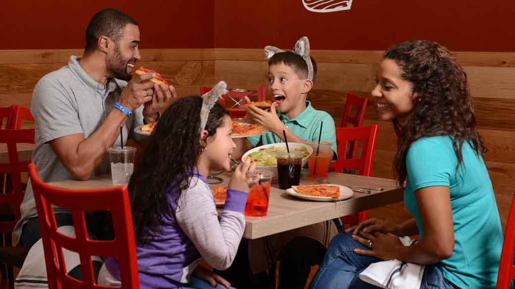 Family enjoying pizza at Great Wolf Lodge 