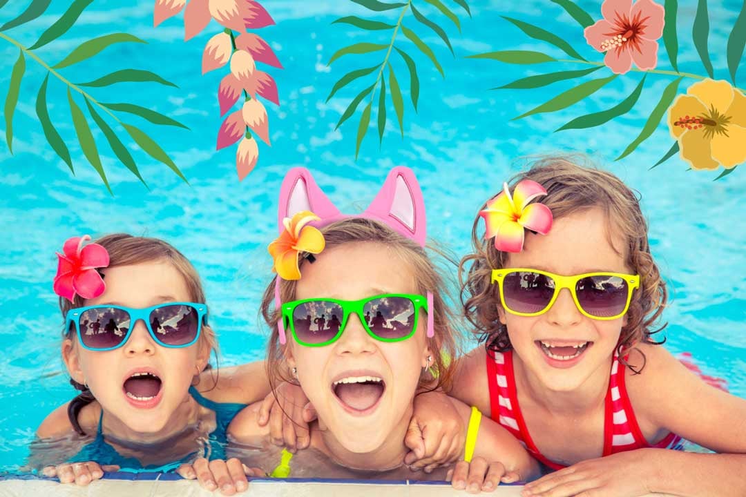 Three little girls wearing glasses in a pool 