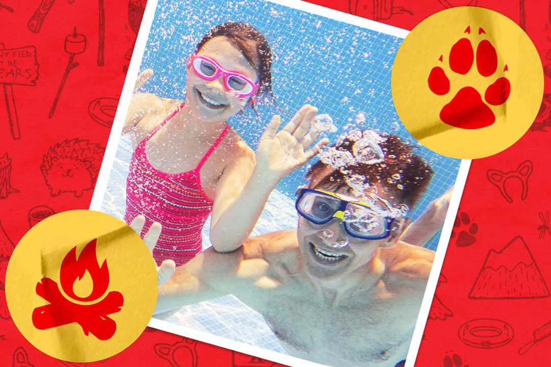 Father and daughter playing in the pool