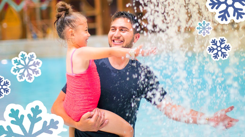 Father and daughter enjoying a waterfall