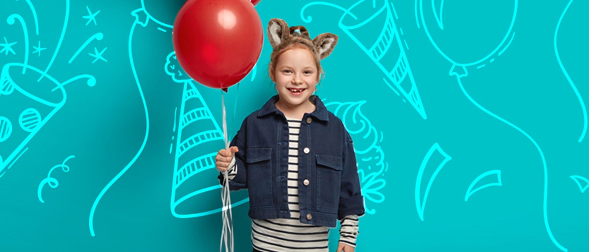 girl holding red balloons and celebrating her birthday 