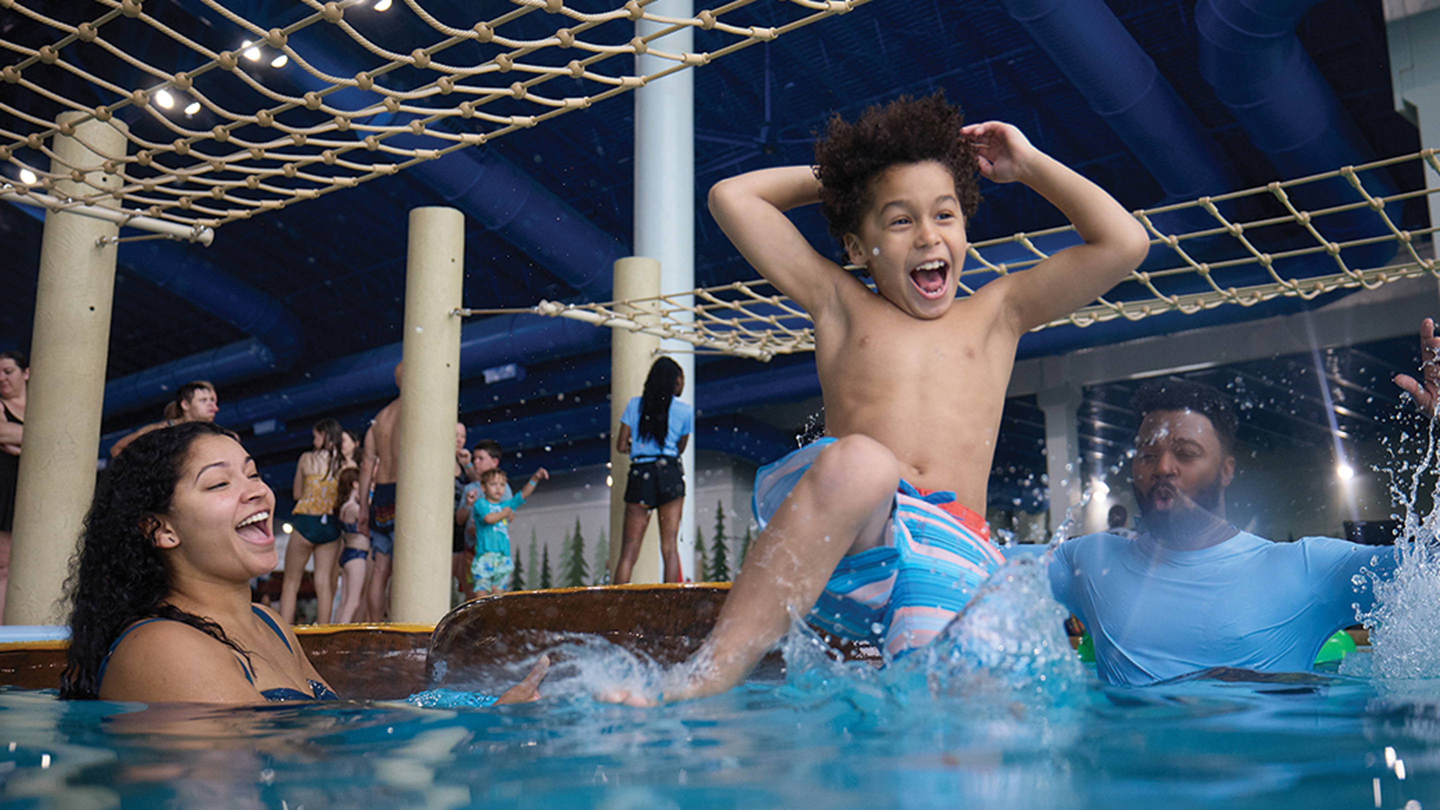 Young boy playing in a indoor pool at Great Wolf Lodge