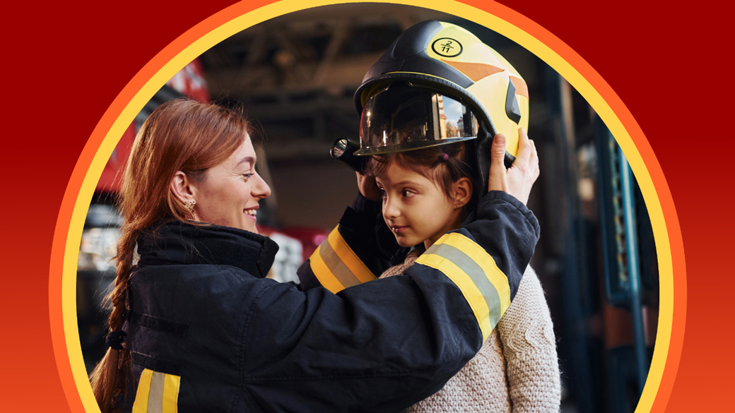 A Californian fighter fighter putting her helmet on a little girl 