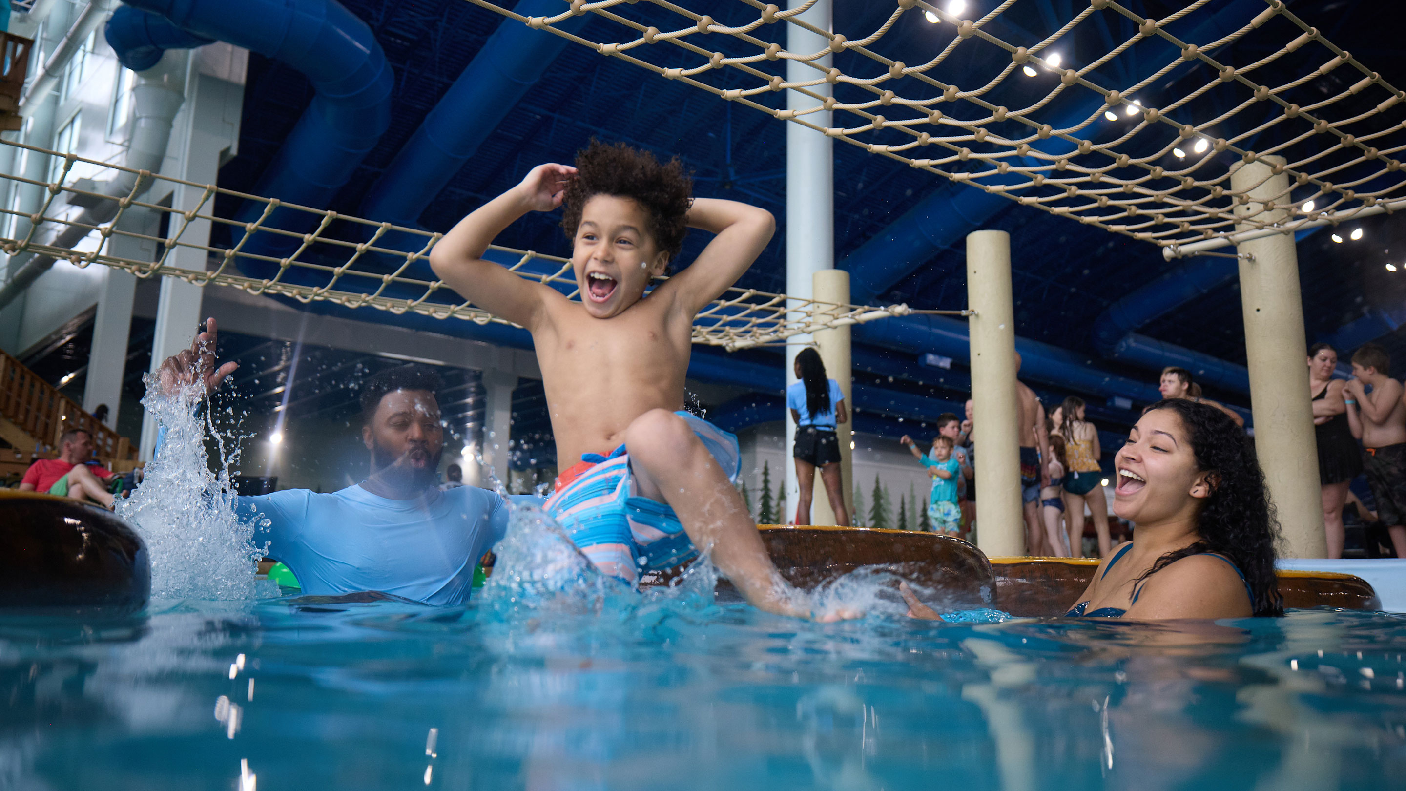 Young boy playing in a indoor pool at Great Wolf Lodge