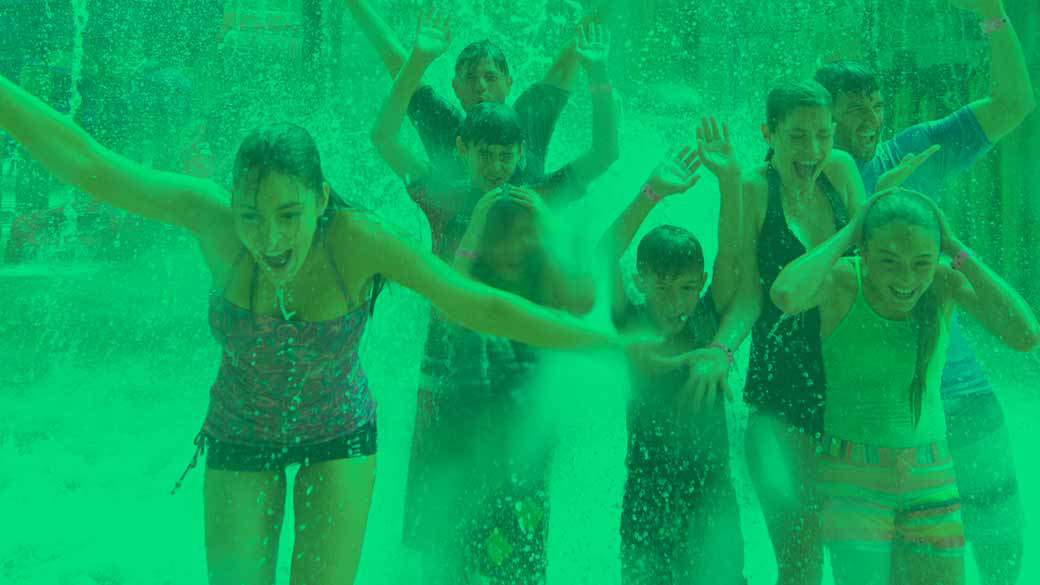 Family playing in a indoor pool 