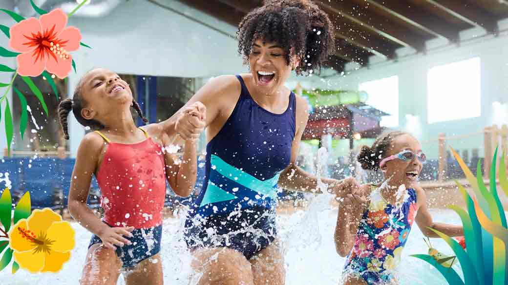 Mother and two daughters holding hand and running in a wave pool at Great Wolf Lodge 