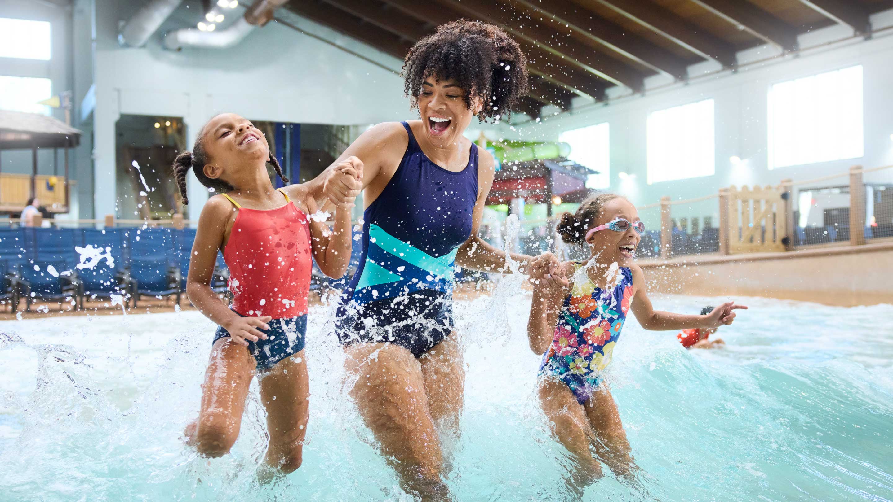 family enjoying sliding down a tube on a waterslide