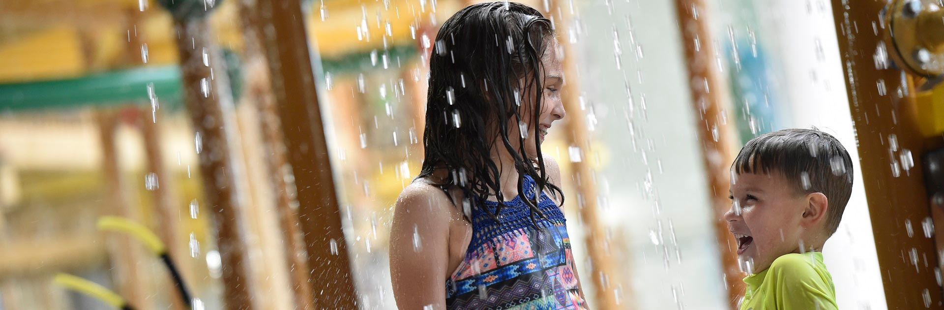 A girl smiles as she tubes along the lazy river