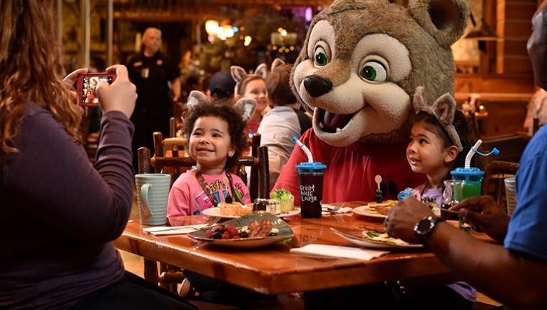 Wiley the Wolf poses for pictures with children