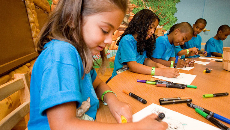 A girl takes part in a crafts event