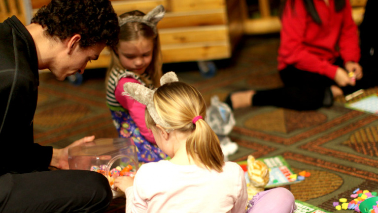 two young girls playing wileys howlin bingo at the pajama party at great wolf lodge