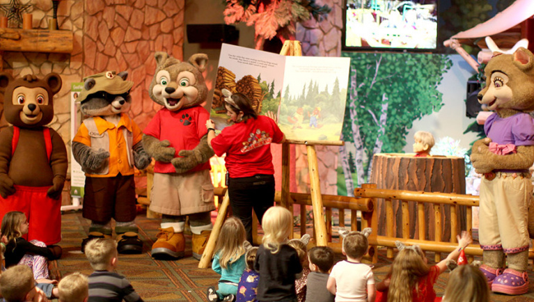 Great Wolf Lodge pack members leads childern wearing PJ's iat the story activity at Great Wolf Lodge indoor water park and resort.