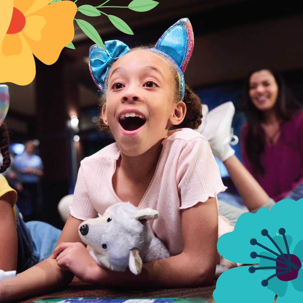 kids sitting in the main lobby with flower balloons playing bingo