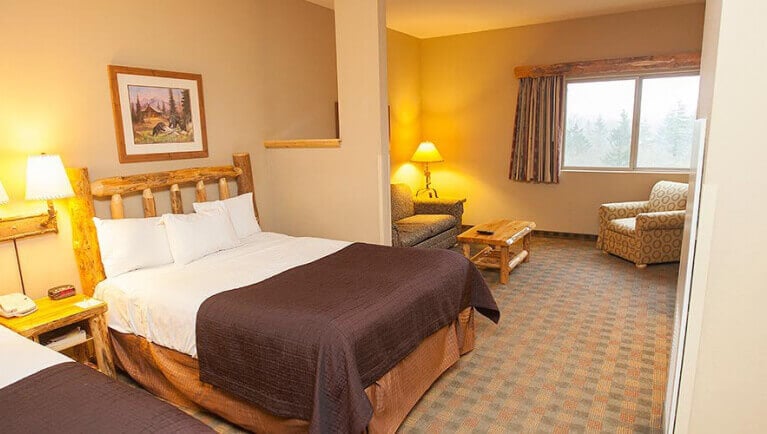 The bed along side with lamp in the Majestic Bear Suite at Great Wolf Lodge Niagara Falls, ON.