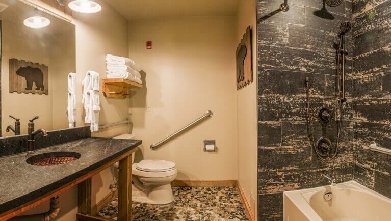 The bathroom in the Accessible Woodland Bunk Suite