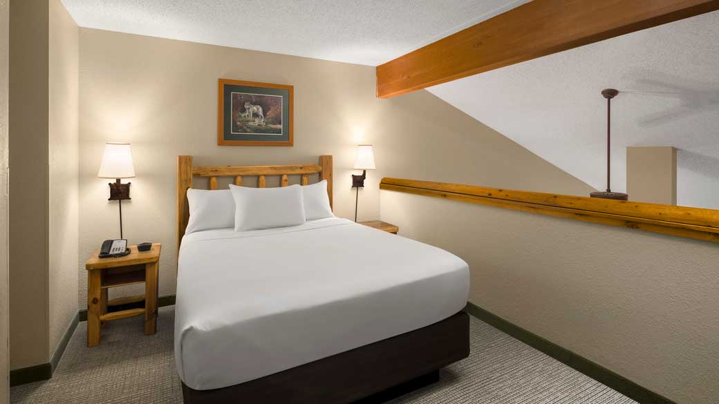 The bed and sink area in the Loft Fireplace Suite(balcony/patio)