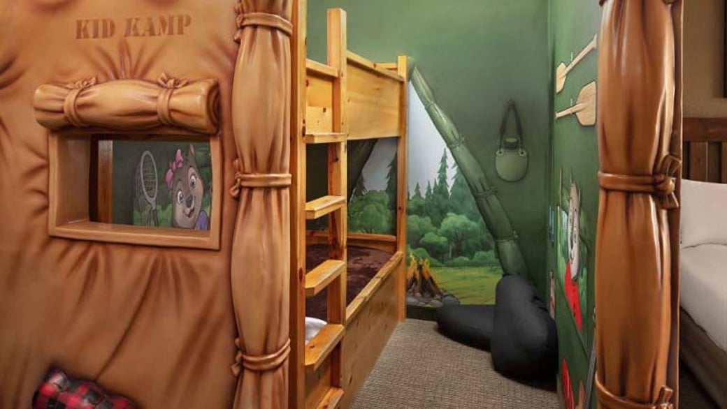 The bunk beds and TV inside the tent in the KidKamp Suite (Balcony/Patio)