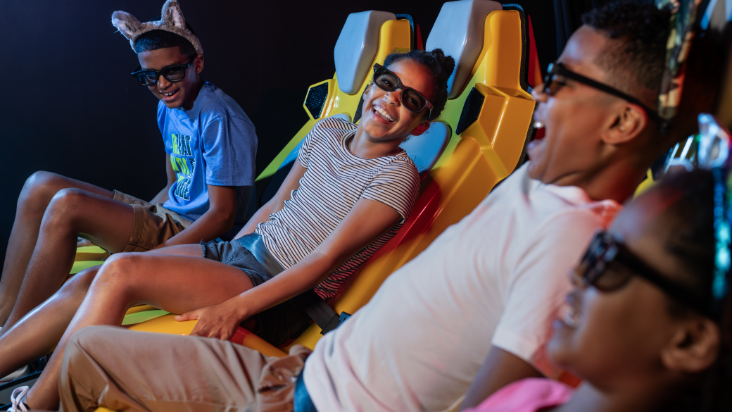 A boy takes off his 3D glasses