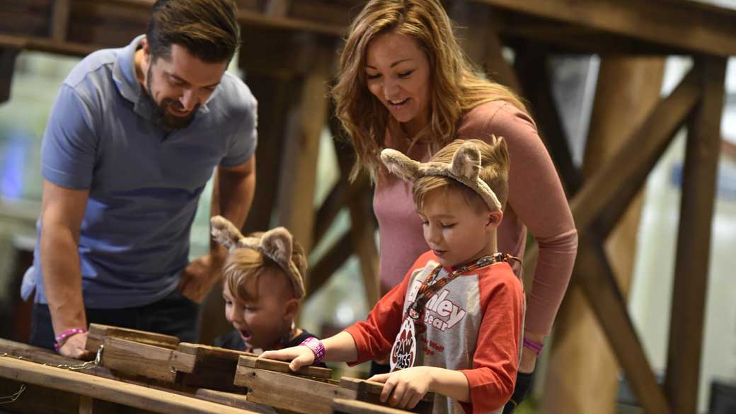 parents looking at their kids gem panning