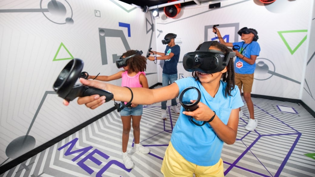 Girl pointing the device to enjoy the VR experience