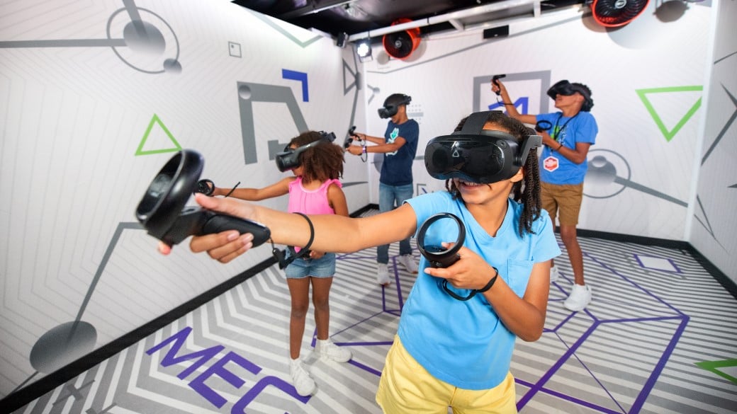 Girl moving the device to enjoy the VR experience