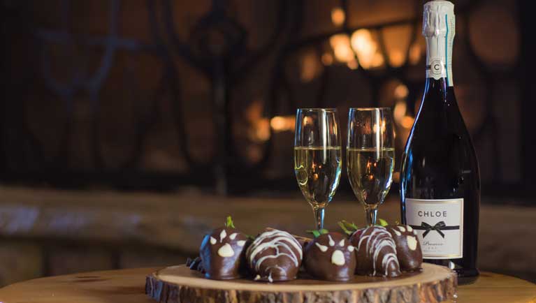 sparkling wine with chocolate coated strawberries