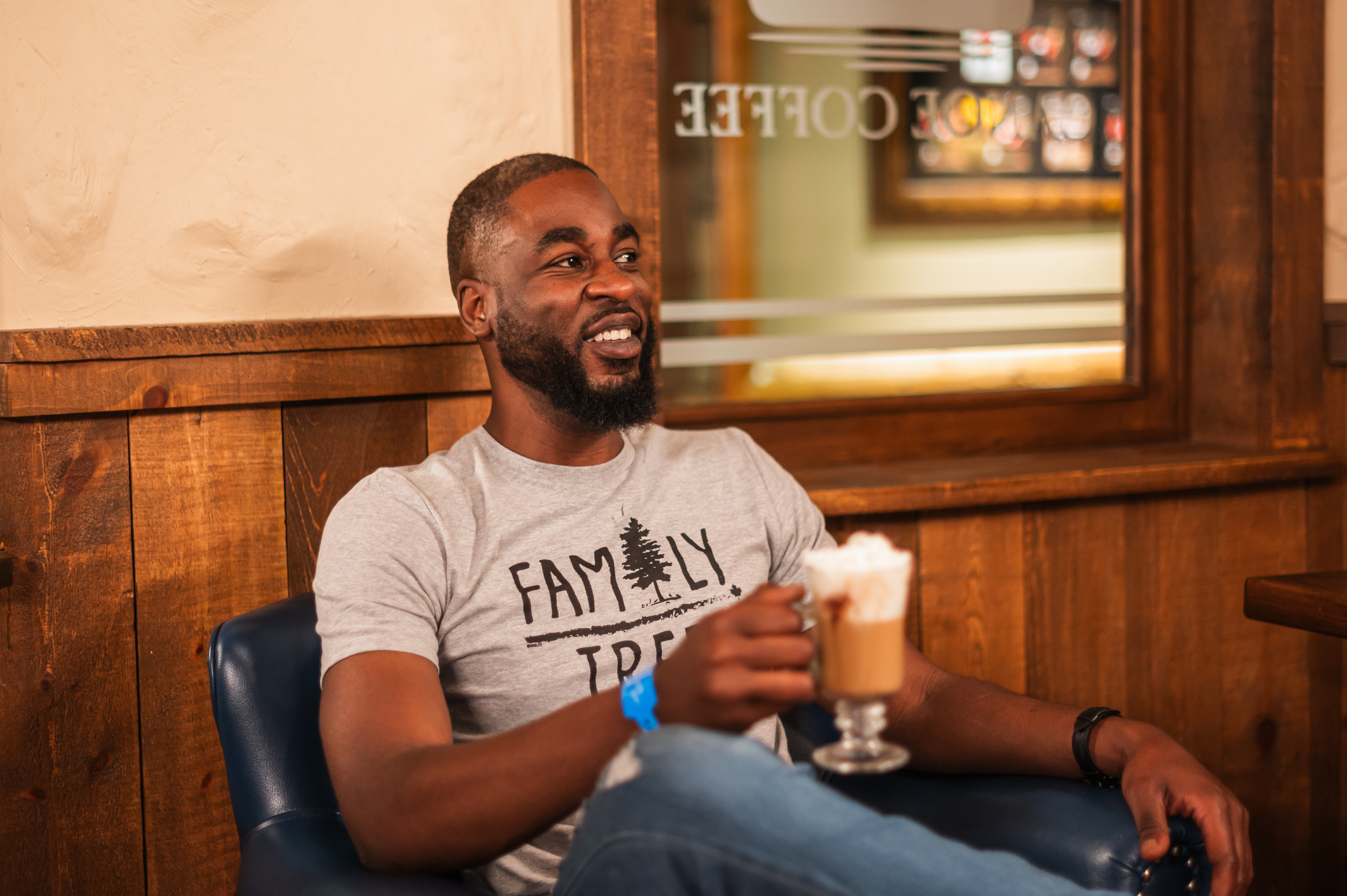 male guest enjoying coffee with whipped cream