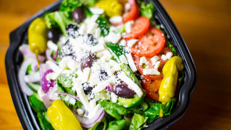 https://www.greatwolf.com/content/dam/greatwolf/sites/www/things-to-do/dining/northwoods-pizza/greek-salad-767x434.jpg