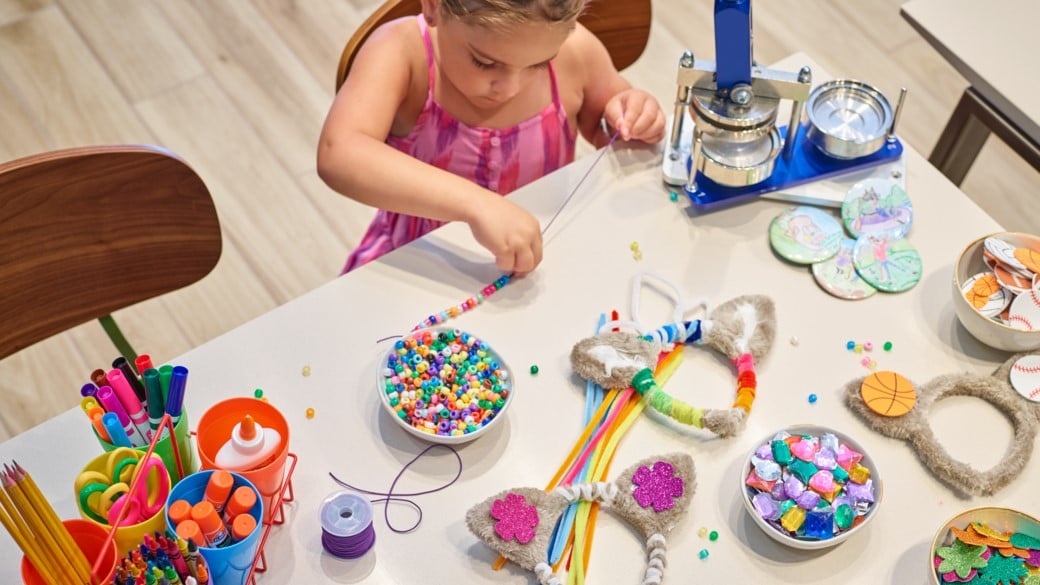 Girl being creative with her different art accessories