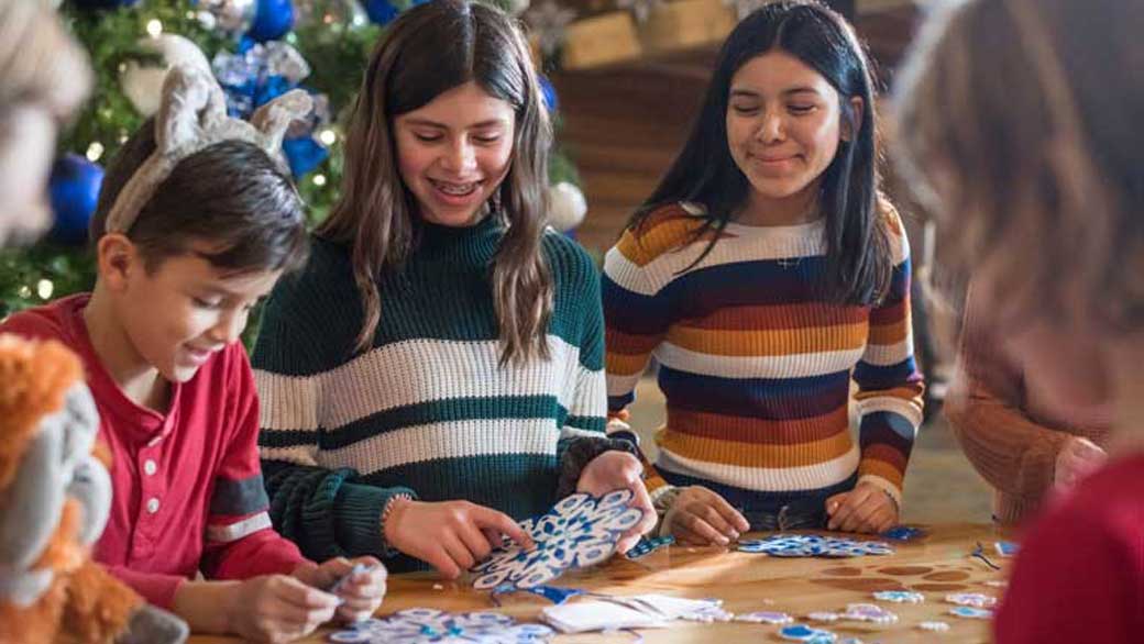 Kids enjoying making snow land themed crafts