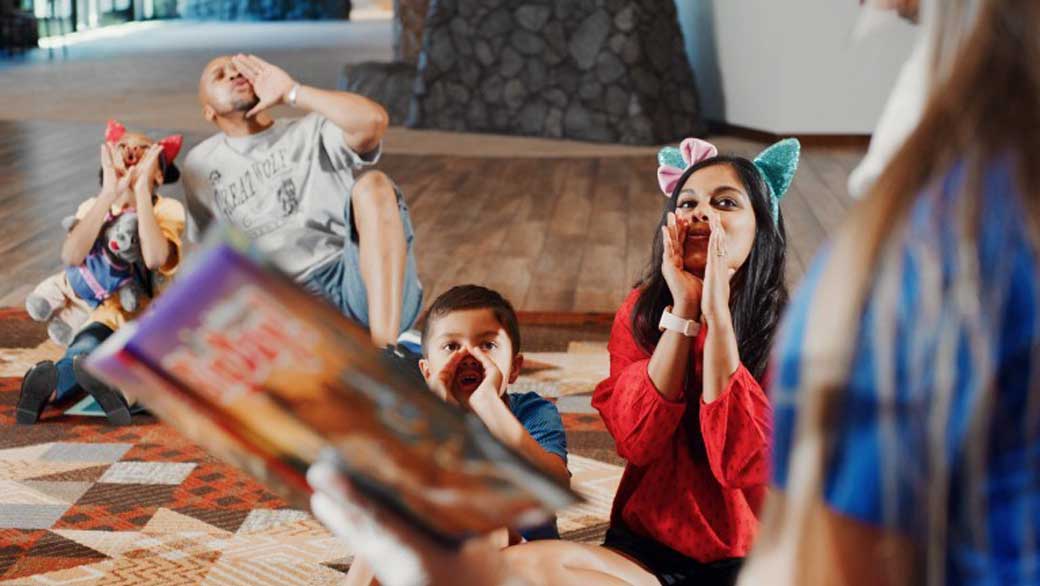 a family howls as they listen to the story