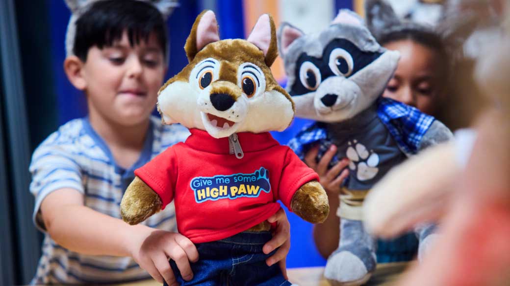 boy holding a stuff toy