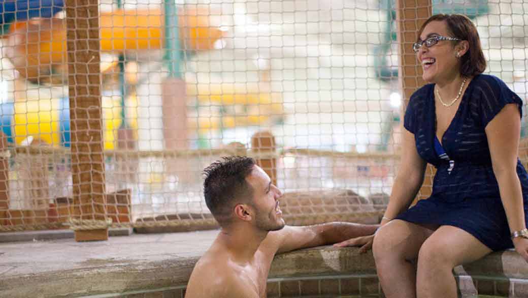 couple enjoying the pool area