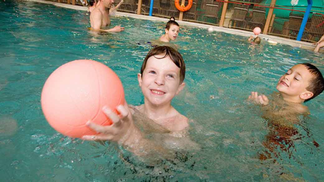 Boy enjoying with ball at Otter Lake