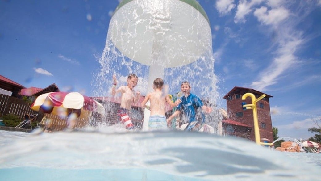 Family enjoying an outdoor waterpark