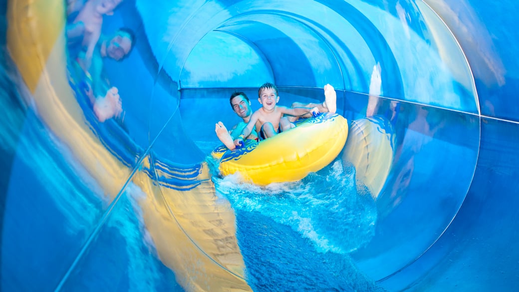 Father and son slides down albetra falls 