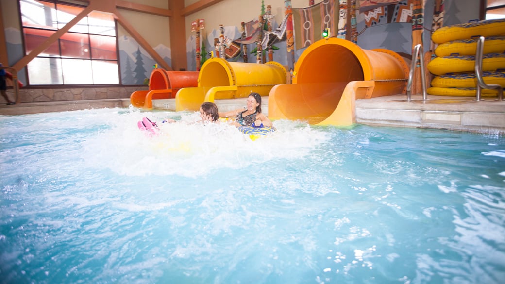 mother and daughter coming down a water slide